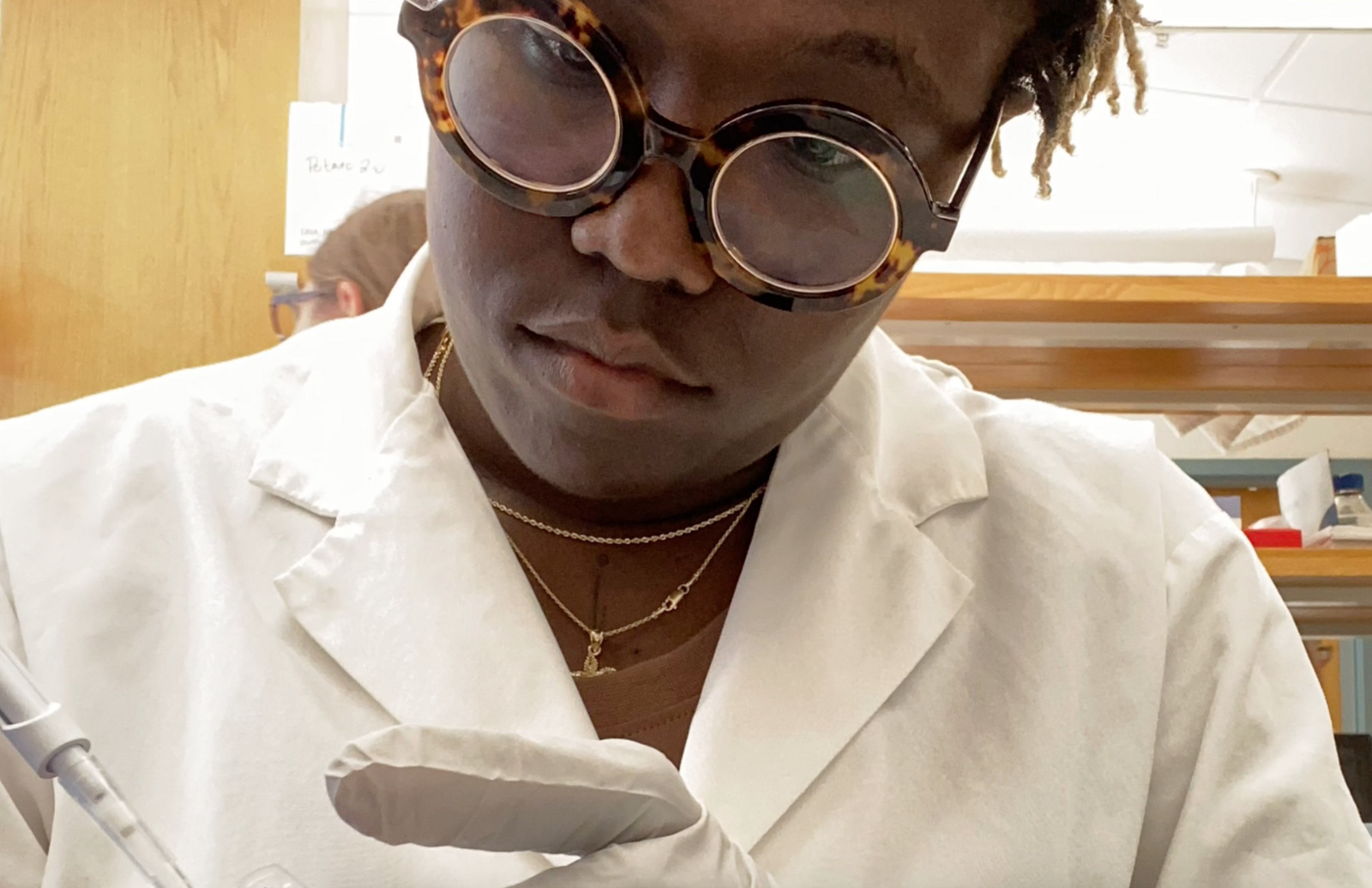 Fort Valley State University student Audree Garrett conducts an experiment in the lab of GRA Eminent Scholar Robin Buell at UGA. Garrett introduced viruses into tomato plants to generate more terpenes, a chemical that holds promise for new medicines and products that benefit people.